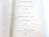 an open book with a title on it on a table