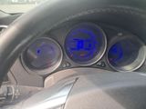 a close up of a car dashboard with various gauges