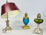 three different types of lamps and a lamp shade on a white surface