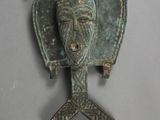 an old bronze head of a man with a helmet on it ' s head
