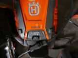 a close up of an orange and black mower
