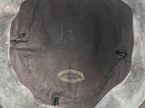a close up of a hat on a white surface