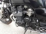 a motorcycle that is parked on the side of the road