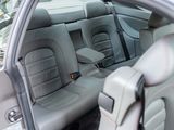 the interior of a car with the door open and the seat up
