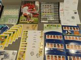 a table with a lot of stamps and stamps on it