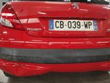a red car that is parked in a garage