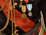a statue of a man in a uniform with medals on his chest