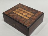 an image of a wooden box on a white surface