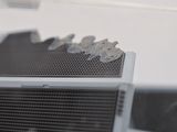 a black and white photo of a radiator with a blade on it