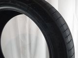 a close up of a tire on a white surface with a white background