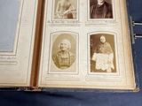 a book with pictures of people on it on a table