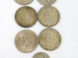 six different types of coins on a white surface