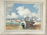 a man holding a painting of boats on the beach
