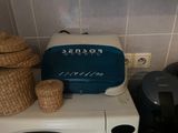 a microwave with a toaster and a toaster on top of it