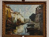 une photo d'un tableau posé sur un chevalet près d'un mur de briques