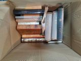 a box full of books sitting on top of a table