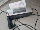 a remote control sitting on top of a table next to a window