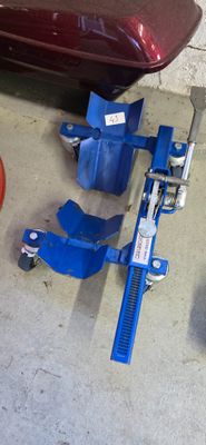 an image of a car being worked on by a mechanic