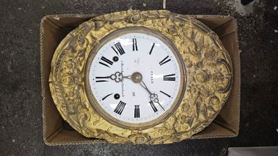 a clock in a box with roman numerals on it