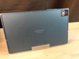 a laptop that is sitting on a wooden table