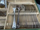silverware in a box with spoons, forks and spoons in it