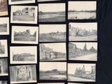 a black table with a bunch of old photos on it