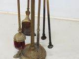 a lot of brooms and a brush on the floor