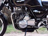 a motorcycle that is parked on the side of the road