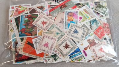 a bag full of stamps sitting on a table