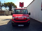 a red truck parked in front of a white building