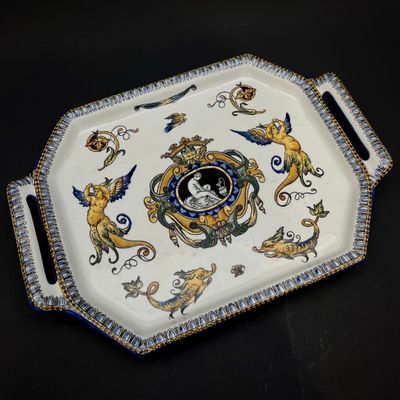 a tray with a picture on it on a black table
