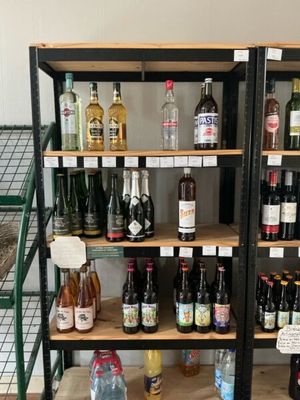 many bottles of alcohol on the shelves in the store