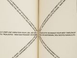 a person holding a book with a cross drawn on it
