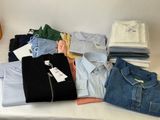 a lot of clothes that are on a table