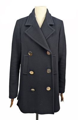 une photo d'un manteau noir de la marque Peale sur un mannequin