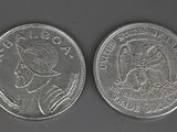 an image of two silver coins, one of which is a woman and the other of which is a man