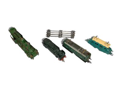 four toy trains that are sitting next to each other