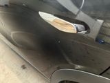 a close up of a car door handle with a sticker on it