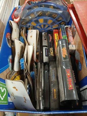 a blue box filled with assorted items on a table