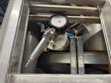 a close up of a machine with a pressure gauge in it