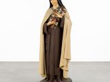 a statue of a woman holding a cat in her hands