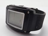 a digital watch that is sitting on a white surface