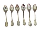 six silver spoons are lined up in a row on a white surface