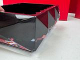 a black box with a red design on it