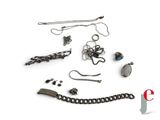 a lot of jewelry that is laying out on a white surface
