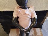 a black mannequin sitting on top of a box