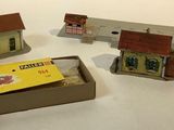 a box with a box of matches and a box with a house in it