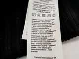 a label on the back of a black jacket