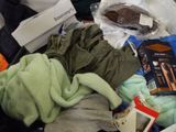 a pile of clothes that is sitting on a table