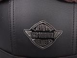 the back of a pair of black leather shoes with a logo on the side